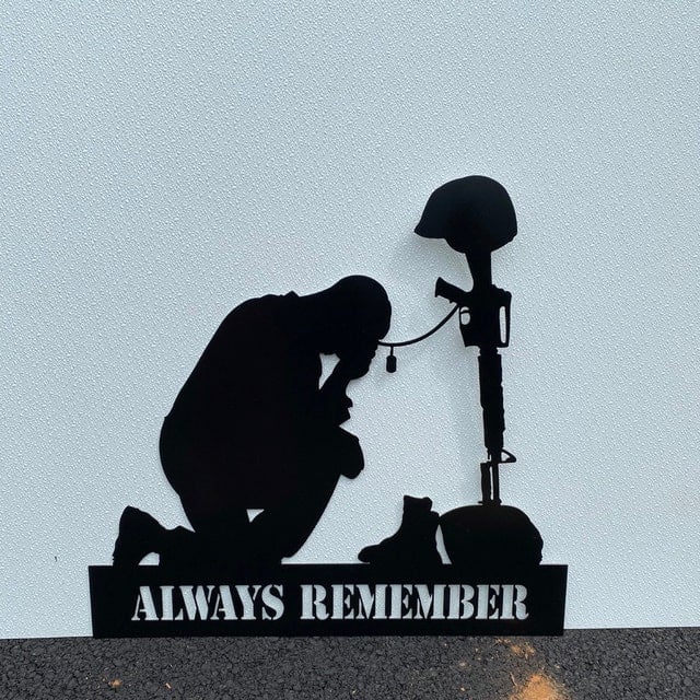 Memorial metal plaque for fallen soldiers, yard
